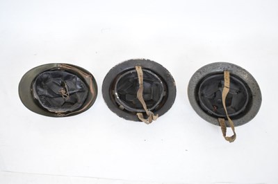 Lot 426 - French 'Adrian' steel helmet and two British 'Brodie' steel helmets