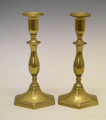 Lot 276 - Pair of George III brass candlesticks on hexagonal bases