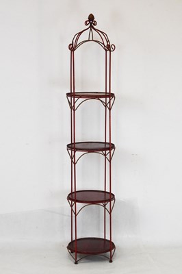 Lot 715 - Four-tiered plant stand in red and gilt finish