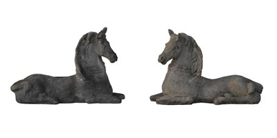 Lot 656 - Pair of composition recumbent horses