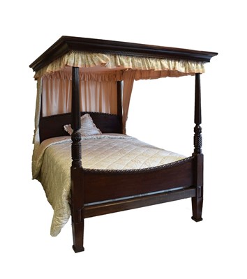 Lot 696 - Mahogany four-poster bed