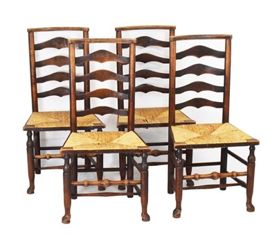 Lot 638 - Four early 20th Century rush seated ash country ladderback chairs