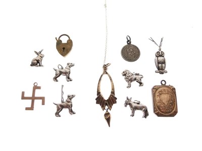Lot 63 - Assorted white metal charms, etc