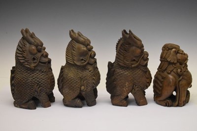 Lot 155 - Four South East Asian carved Temple Dogs