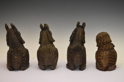 Lot 155 - Four South East Asian carved Temple Dogs