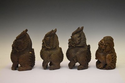 Lot 155 - Four South East Asian carved Temple Dogs