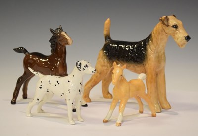 Lot 307 - Beswick - Two foals, together with an Airedale Terrier and  a Dalmation