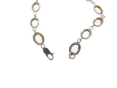 Lot 29 - Twelve-stone opal bracelet
