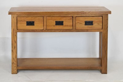 Lot 506 - Modern light oak three drawer console table