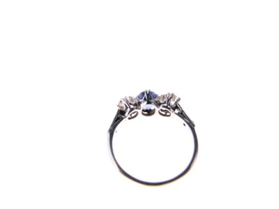 Lot 17 - Sapphire and diamond three-stone ring