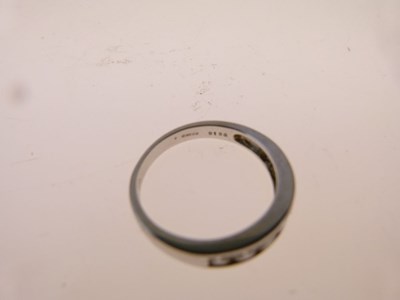 Lot 11 - Seven-stone diamond half hoop ring