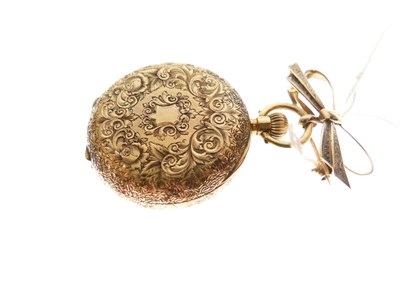 Lot 114 - Lady's yellow metal (18K) fob watch on a 9ct bar