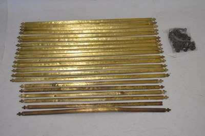 Lot 565 - Twenty-one brass stair rods and a quantity of cups