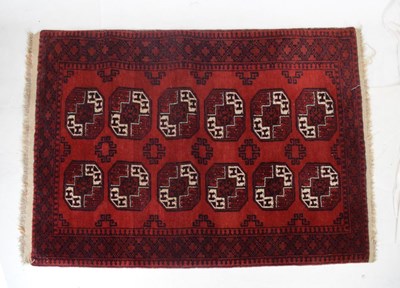 Lot 413 - Middle Eastern Tekke or Belouch red ground rug