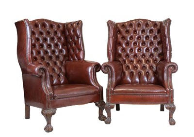 Lot 725 - Good pair of deep buttoned oxblood leather wing armchairs