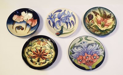 Lot 299 - Moorcroft Pottery - Five pin dishes