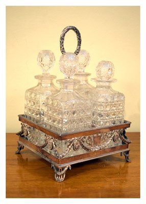 Lot 745 - Silver plated decanter stand with four glass decanters