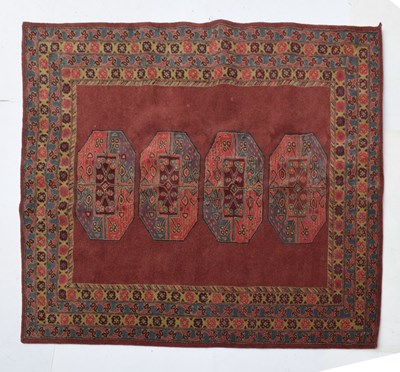 Lot 416 - Wool rug or carpet, flecked burgundy field with four large guls