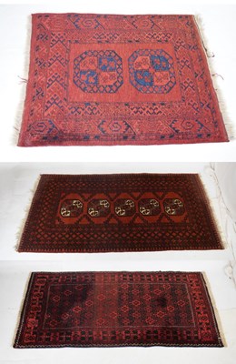 Lot 417 - Three Middle Eastern red ground rugs