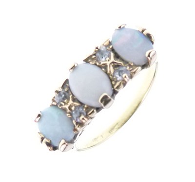 Lot 27 - Three-stone opal ring, stamped '18ct'
