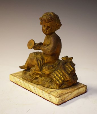 Lot 300 - Cast cherub musician