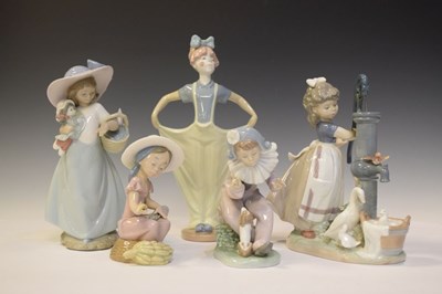 Lot 310 - Lladro figure, and four Nao figures