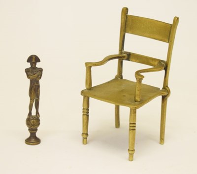Lot 162 - Miniature novelty brass chair and Nelson tobacco tamper