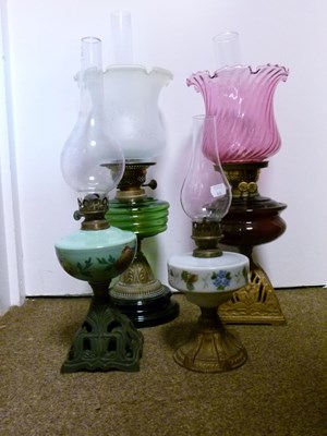 Lot 749 - Group of oil lamps and shades