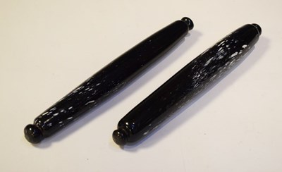 Lot 324 - Two early Nailsea-type glass rolling pins