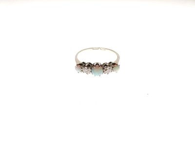 Lot 33 - Opal and diamond five-stone ring