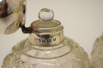 Lot 121 - Pair of Elizabeth II silver mounted scent bottles