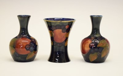 Lot 393 - Pair of William Moorcroft 'Pomegranate' pattern vases plus another