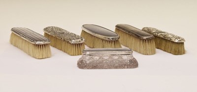 Lot 196 - Five assorted silver-backed clothes brushes