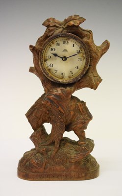 Lot 630 - Swiss carved linden wood mantel clock