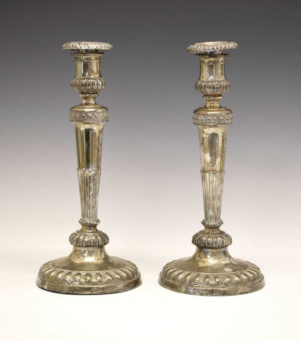 Lot 151 - Pair of George III silver candlesticks on tapering fluted columns