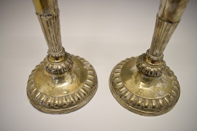 Lot 151 - Pair of George III silver candlesticks on tapering fluted columns