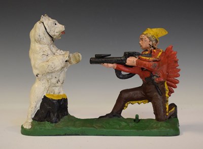 Lot 294 - Cast iron money bank of a red Indian shooting a bear