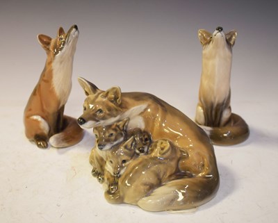 Lot 405 - Royal Copenhagen - Three porcelain figures, comprising pair of seated foxes