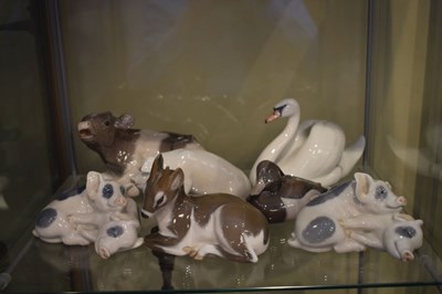 Lot 403 - Royal Copenhagen - Collection of porcelain figures, comprising cow, pigs, duck, swans etc