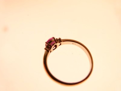 Lot 8 - Pink sapphire and baguette cut diamond three-stone ring