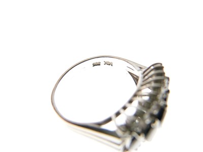 Lot 15 - White metal (14K) sapphire and diamond ring