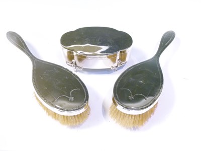 Lot 246 - Two silver-backed dressing table brushes and oval box