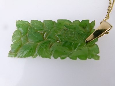 Lot 63 - Carved foliate jade panel pendant