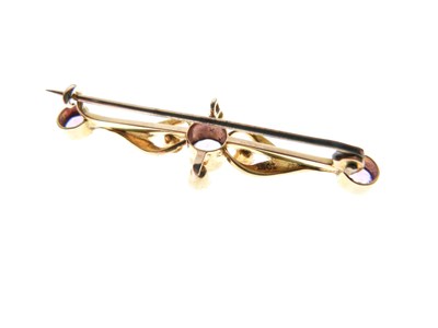 Lot 145 - Edwardian yellow metal (15ct), amethyst and seed pearl bar brooch, and a yellow metal (15ct) tie pin