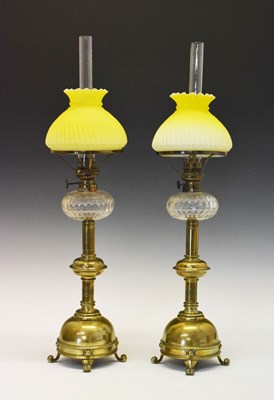 Lot 243 - Pair of brass oil lamps