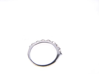 Lot 12 - Seven stone diamond half hoop ring