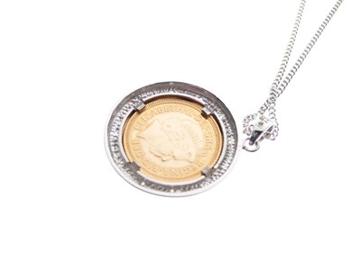 Lot 100 - Royal Mint Limited Edition 2002 half sovereign in 9ct white gold diamond-set pendant