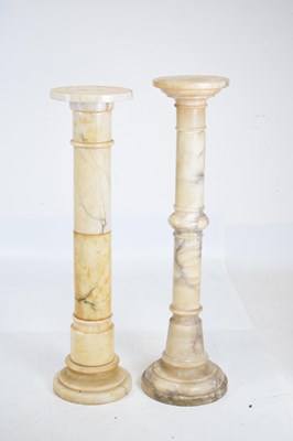 Lot 657 - Two similar sectional veined alabaster pedestals