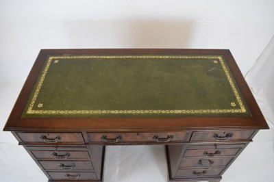 Lot 657 - Reproduction mahogany twin pedestal desk