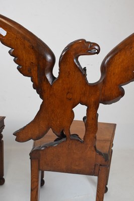 Lot 721 - Pair of Victorian carved oak armorial hall chairs